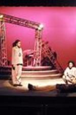 View of actors on stage during a performance of Antigone.