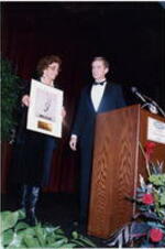 An unidentified man and woman holding an award at the Atlanta Student Movement 20th anniversary event.