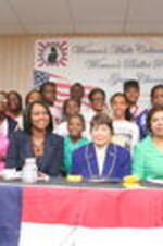 A group photo of Evelyn G. Lowery (seated, second from left) with others at a Women's Multi Cultural Forum event focused on the topic of "women's ballot power".