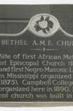 View of historic site sign at Bethel AME Church; on sign: Bethel A.M.E. Church, Site of first African Methodist Episcopal Church (1864), and first Negro Masonic Lodge in Mississippi organized here (1875). Campbell College was organized here in 1890. Present church was built in 1912.