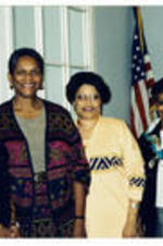 Marylin Holmes, Andretta Nance, Sylvia Suitt, and Alexis Scott stand in the corner of a room. Written on verso: Chautauqua Circle New Members, Marylin Holmes, Andretta Nance (Saxon), Sylvia Suitt, M. Alexis Scott.