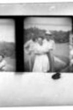 A contact sheet with three photographs of unidentified people out on a grassy lawn.