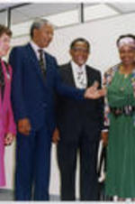 Joseph E. Lowery and Winnie Mandela smile for the camera as Evelyn G. Lowery and Nelson Mandela look on during the Mandela's visit to Atlanta, Georgia.