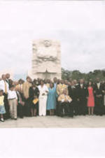 A digital photo printed on computer paper showing Joseph E. Lowery and others gathered in front of the Martin Luther King, Jr. Memorial statue in Washington, D.C.