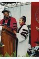 Thomas W. Cole, Jr. stands with Xernona Clayton at the podium at commencement.