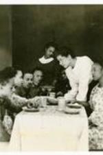 View of actors in a scene. Written on verso: The University Players Production; Family Portrait, 1941-42.