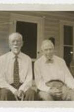 Arthur Bumstead and George K. Howe sitting on front porch steps of a house. Written on verso: To the Towns, Atlanta, Ga, June 2, 1959, His last visit to Atlanta Univ., Mr. George K. Howe, Mr. Arthur Bumstead, Son of Dr. Horace Bumstead, 2nd president of Atlanta Univ.