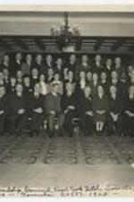 Indoor group portrait of men and women. Written on recto: United Stewardship Council Royal York Hotel, Toronto, Canada, Annual Meeting - November 26-27, 1945.