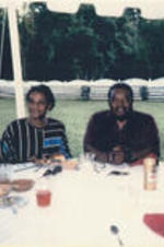 C. Eric Lincoln sits at a table with other guests at Alex Haley's house in Tennessee.