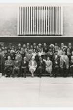 Outdoor group portrait of men and women at C.L.A. Annual Conference.