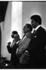 Maynard Jackson sings along with other people at a church.