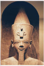 A statue wearing the traditional crown of Egyptian pharaohs.