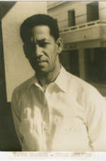 Portrait of Teodoro Ramos Blanco standing outside. Written on verso: Ramon Blancos; Cuban Sculptor; Photograph by Carl Van Vechten; 101 Central Park West; Cannot be reproduced without permission; March 11, 1951.