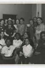A group pf women and girls at a reception.
