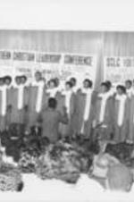 An audience is shown enjoying a choir performance at the 28th Annual Southern Christian Leadership Conference (SCLC) Convention.