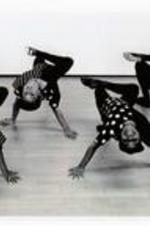 Written on verso: Four members of the Children's Dance program display their artistic moves.