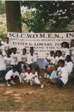 Evelyn G. Lowery (on left) is shown posing for with picture with a group of young women during a SCLC/W.O.M.E.N. Bridging the Gap: Girls to Women Mentoring Program event.