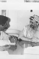 Southern Christian Leadership Conference (SCLC) President Joseph E. Lowery speaks with Palestinian Liberation Organization chairman Yasser Arafat. Lowery was in Lebanon as part of a SCLC peace mission with other delegation members.