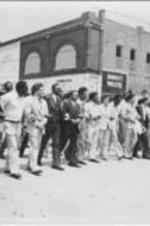 Joseph and Evelyn Lowery (at center) are shown marching with Walter E. Fauntroy, John Nettles, Claud Young, C.T. Vivian, and others in support of Tommy Lee Hines.