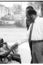 John R. Lewis meets with an old woman in Drew, Mississippi during a voting rights tour.
