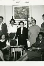 Virginia Lacy Jones with a group of women in a living room.