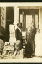 Portrait of Archer Family in front of a house.