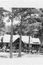 Gathering in front of the Camilla-Zach Country Life Center. Written on verso: GA-Handbook-8-10-45- Log Cabin Community. This picture of Camilla-Zach country life center in Log Cabin Community was made as farm people gathered for a soil conservation meeting. SCS photo by Gordon Webb.
