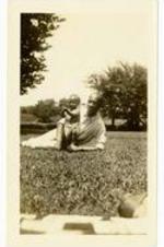 Beth Angela Warren and Gladstone L. Chandler, Sr. laying in the grass. Written on verso: Beth at 8 1/2 months. Not a clear picture if you should run into either of us in New York and had only this picture to identify us by, I think you'd not miss your guess. Channie.