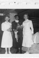 Anna E. Hall standing with unidentified nurses.