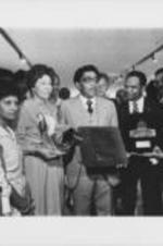 Joseph E. Lowery, Evelyn G. Lowery, and Walter Fauntroy are shown holding awards at an unknown event.
