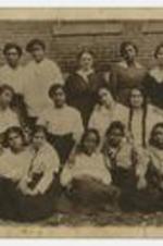 Outdoor group portrait of women. Written on verso: Bertha Mae Yarbrough Touchstone, third row, second from right.