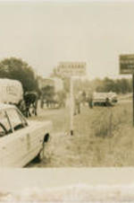 Horses and wagons that are part of the Poor Peoples' Campaign are shown marching past policemen while crossing the Mississippi-Alabama state line.