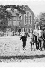 Children stand in front of Thirkield Hall.