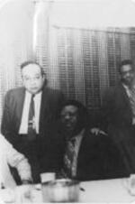 Ralph D. Abernathy, sitting, poses for a photo with Reverend Dr. Bernel Virdure, president of International Divine Temple, Inc. in East Palo Alto, during the OICW Awards Banquet in Palo Alto, California. Written on verso: OICW Awards Banquet, Palo Alto, Calif. 1974, Rev. Dr. R. Abernathy, Rev. Dr. B.B. Virdure
