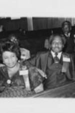 Reverend &amp; Mrs. Abraham Woods are shown sitting with others at the 23rd Annual Southern Christian Leadership Conference Convention. Written on verso: Rev. &amp; Mrs. Abraham Woods. Cleveland '80