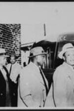 Written on recto: Atlanta, January 10, 1957. Ministers Hauled to Jail in Paddy Wagon. Five Negro ministers leave the paddy wagon at police station today after being hauled to jail on charges that they violated Georgia segregation laws in occupying public bus seats up front which are normally reserved for white passengers. Second from left is their leader, the Rev. William Holmes Borders. They were jailed temporarily until they posted $1,000 bond each.