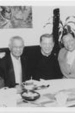 Joseph E. Lowery, C.T. Vivian, Michael Pfleger, Louis Farrakhan, and Harry Belafonte pose for a photograph seated at a table.