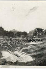 Construction of an Army barrack on the campus of Atlanta University. The Carnegie Library and Oglethorpe School buildings are visible in the background.