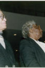 Rosa Parks and Johnnie Carr listen in the audience during the proceedings of a Southern Christian Leadership Conference Spring Board meeting held at Grace Temple Baptist Church in Detroit, Michigan. Written on verso: Rosa Parks and Johnnie Carr; Montgomery