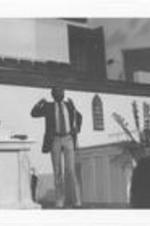 Dick Gregory speaks at an event at a church.