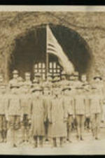 Military men with flag in front of Stone Hall, officer Lt. Joseph Scott right front row.