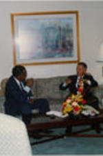 Southern Christian Leadership Conference (SCLC) President Joseph E. Lowery and Ross Perot are shown having a conversation at a Holiday Inn hotel during the proceedings of the 36th Annual SCLC Convention.