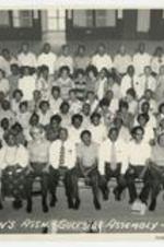Indoor group portrait of men and women. Written on recto: Laymen's Assn.-Gulfside Assembly-1972.