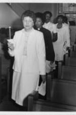 SCLC/W.O.M.E.N. founder and national convener Evelyn G. Lowery is shown leading a line of women at the National Women's Candlelight Prayer Service. The prayer service was dedicated to the memory of Atlanta's missing and murdered children and their families.