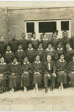 A group photo of men and women dressed in caps and gowns at Centenary United Methodist Church. Written on verso: Centenary United Methodist Church, 35-40, Property of Mrs. Evelyn Gibson Redmond.