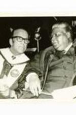 Written on verso: Joshua Nkomo chats informally with Dr. Gloster before his commencement address. May, 1979.