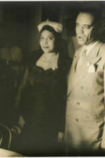 Gerri Major stands next to Lindsey H. White at a party commemorating Josephine Baker Day. Written on verso: Gerri Major with Lindsey H. White at Miss Baker's cocktail party; Photograph by Carl Van Vechten; 101 Central Park West; Cannot be reproduced without permission; May 20, 1951.