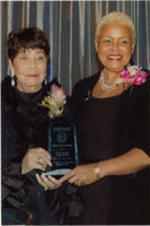 Evelyn G. Lowery poses for a photo with a representative from The Atlanta Daily World newspaper at the 33rd Annual SCLC/W.O.M.E.N. Drum Major for Justice Awards dinner.