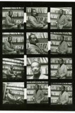Proof sheet of Hoyt Fuller sitting and standing in a library.