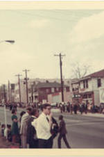 Onlookers line the street to watch Martin Luther King Jr.'s funeral procession.